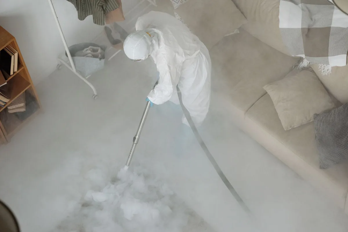 Biohazard cleanup technician in protective equipment, Thunder Mountain, NM